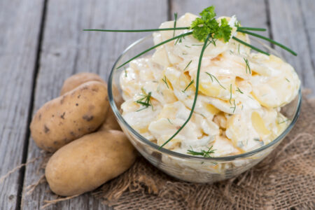 Portion of homemade Potato Salad with fresh herbs